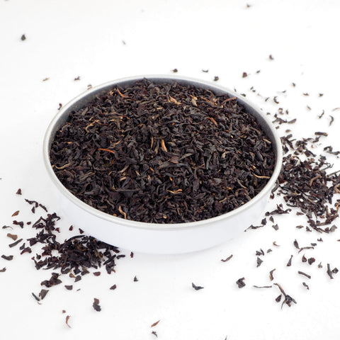 A bowl filled with loose leaf Kenya tea, showcasing the tea leaves