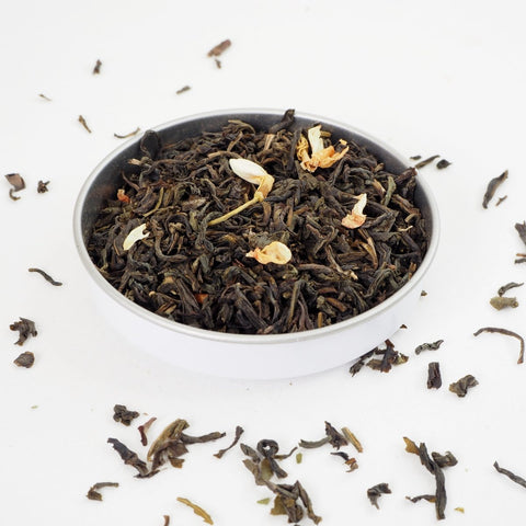 The Jasmine Flowers are dried together with green tea and this can be seen here with Jasmine with flowers Loose Leaf Tea from Teaspoon Tea Co. Large green loose leaf tea can be seen with yellow jasmine flower heads. A very taste Green Tea indeed.