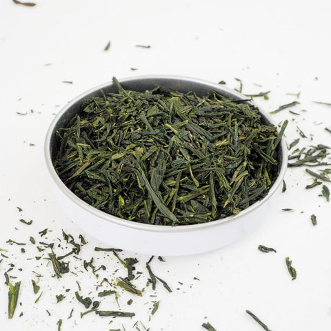 This Japanese Green Tea is Sencha Fukujyu from Teaspoon Tea Co. A tasty Green Tea that is bright and grassy. Here the tea is shown in a shallow dish. The leaves are long and thin and range in shades of green from light to dark