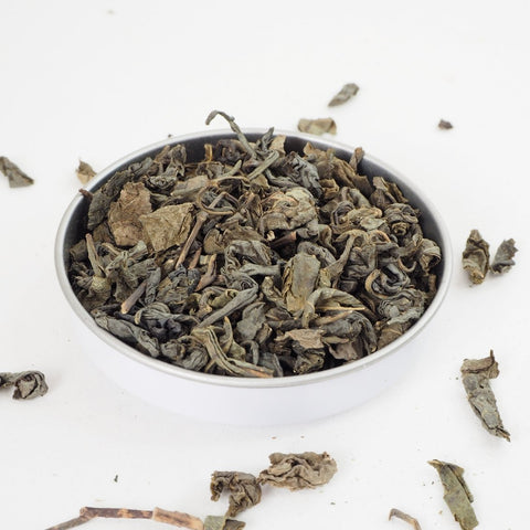 Gunpowder Green Loose Leaf Tea from the online teashop Teaspoon Tea Co. Shown here, the Green Tea leaves are picked and rolled into balls. This green tea is strong and tasty.