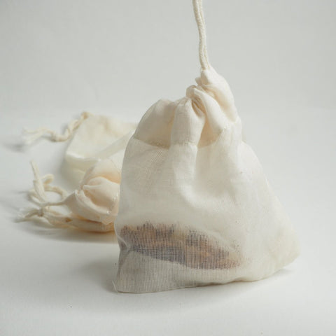 A reusable teabag with tea into and the drawstring pulled