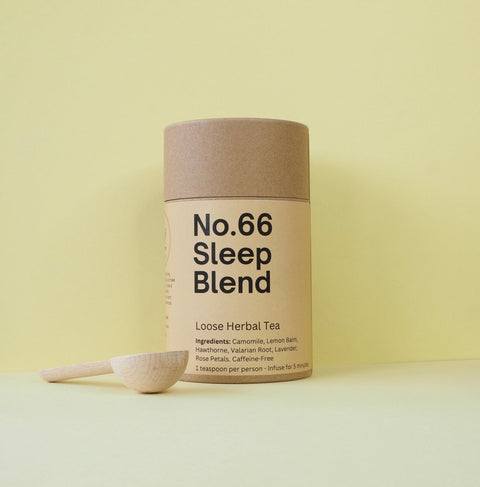 Tub of sleep blend with a wooden teaspoon