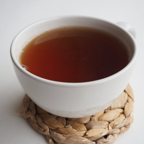 A cup of strong black tea made using Assam loose leaf Tea from Teaspoon Tea Co