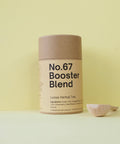 Tub of booster blend with a wooden teaspoon