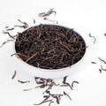 English Breakfast, Loose English Breakfast Tea from online teashop Teaspoon Tea Company, Large Rolled tea leaves produce a high quality tea shown here in a small shallow dish.