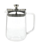 Clear glass teapot with metal infuser lid on a white background