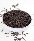 English Breakfast, Loose English Breakfast Tea from online teashop Teaspoon Tea Company, Large Rolled tea leaves produce a high quality tea shown here in a small shallow dish.