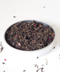 Large loose leaf tea and rose petals, this is Rose Congou Loose Leaf Tea from Teaspoon Tea Co.  The loose leaf tea is large black rolled tea and it looks beautiful with red Rose petals mixed in.
