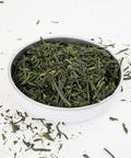 This Japanese Green Tea is Sencha Fukujyu from Teaspoon Tea Co.  A tasty Green Tea that is bright and grassy. Here the tea is shown in a shallow dish.  The leaves are long and thin and range in shades of green from light to dark
