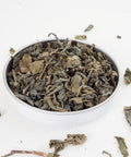 Gunpowder Green Loose Leaf Tea from the online teashop Teaspoon Tea Co.  Shown here, the Green Tea leaves are picked and rolled into balls.  This green tea is strong and tasty.