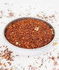Rooibos Tea with Blood Orange from online teashop Teaspoon Tea Co.  With flecks of Rooibos leaf in light orange to red and pieces of orange peel this is an attractive and tasty caffeine-free tea