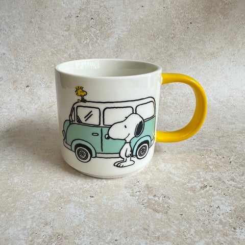 Mug with a design of snoopy dog and a camper van