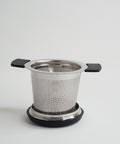 Tea infuser basket on its lid