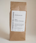 A brown paper bag labeled 'Old Brown Java Coffee Beans' from The Teaspoon Company 