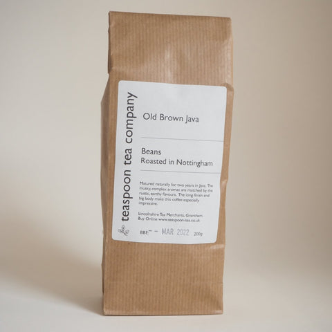A brown paper bag labeled 'Old Brown Java Coffee Beans' from The Teaspoon Company 